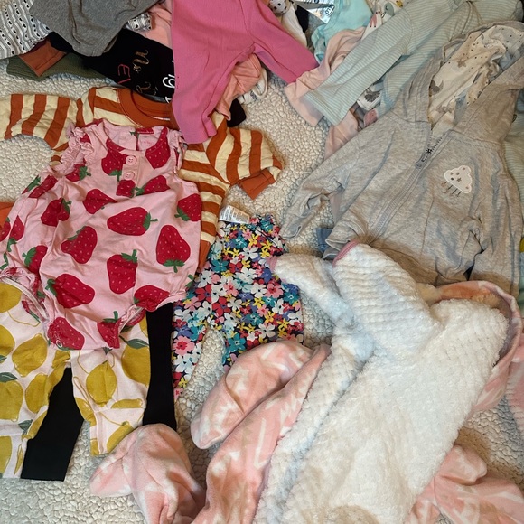 Lot of baby girl clothes. Over 50 pieces ranging from 0-12...